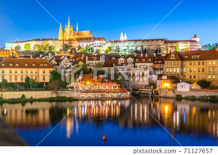 Prague Castle, Czech: Prazsky hrad. Illuminated landmark by night. Vew from Charles Bridge, Praha, Czech Republic Prague Castle, Czech: Prazsky hrad. Illuminated landmark by night. Vew from Charles Bridge, Praha, Czech Republic 71127657