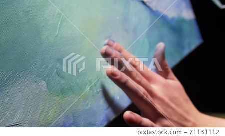 Artist copyist paint seascape with ship in ocean. Craftsman decorator draw as boat sail on blue sea with acrylic oil color. Draw finger brush palette. 71131112