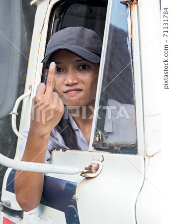 driver of truck showing fuck off 71131784