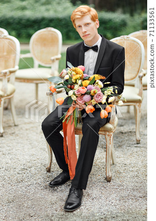 groom with flowers groom with flowers 71133561