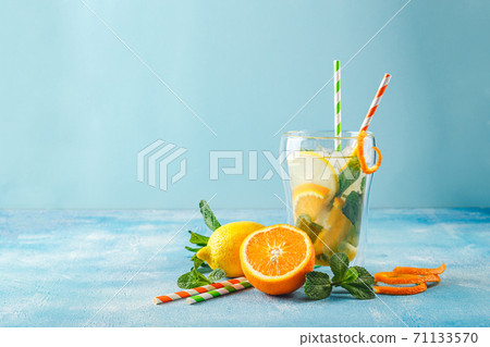Refreshing cocktails with mint with lemon, orange, mint and ice Refreshing cocktails with mint with lemon, orange, mint and ice 71133570