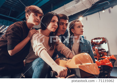 The family supports the mother who drives.  71135062