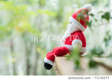 Santa Claus amigurumi sitting on window furniture 71136257