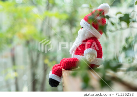 Santa Claus amigurumi sitting on window furniture 71136258