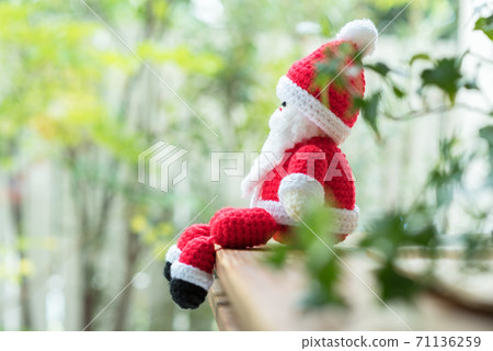 Santa Claus amigurumi sitting on window furniture 71136259