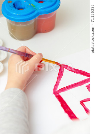 Child's hand drawing the house. Child's hand drawing the house. 71136353