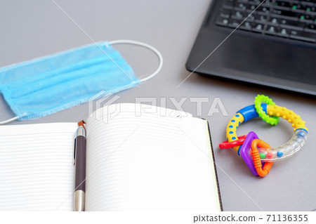 Protective medical mask with open notebook. Protective medical mask with open notebook. 71136355