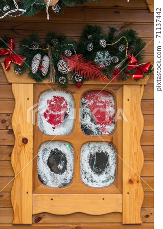 Small wooden window with Christmas decorations. Winter holidays concept Small wooden window with Christmas decorations. Winter holidays concept 71137442