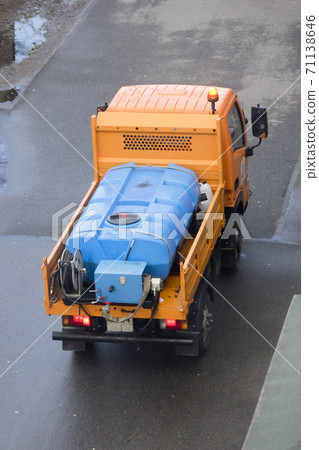 car disinfects a city street during a coronavirus pandemic car disinfects a city street during a coronavirus pandemic 71138646