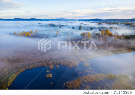 Beautiful aerial view of morning fog and sunrise in autumn 71140599