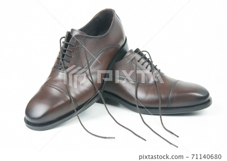 Classic men's brown shoes on white background Classic men's brown shoes on white background 71140680