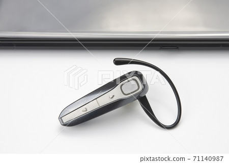 Bluetooth close up with a mobile phone. digital technology of mobile devices in the transmission  71140987