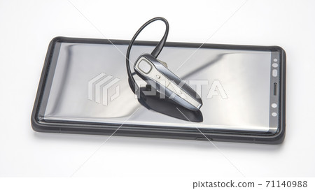 Bluetooth close up with a mobile phone. digital technology of mobile devices in the transmission  71140988