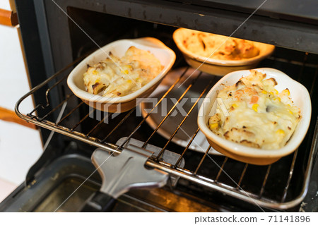 Freshly baked gratin in the oven 71141896
