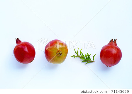 Top view of ripe pomegranate fruit with leaves 71145639