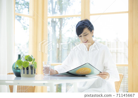 A woman in a cafe A woman in a cafe 71145667