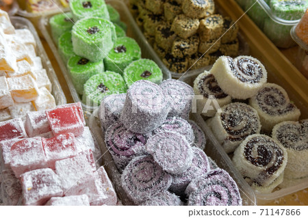 Assortment of Turkish delights. Close up. sale of sweets in the market Bazaar Assortment of Turkish delights. Close up. sale of sweets in the market Bazaar 71147866
