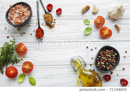 Tomato, basil and pepper with garlic on white wooden background Tomato, basil and pepper with garlic on white wooden background 71148045