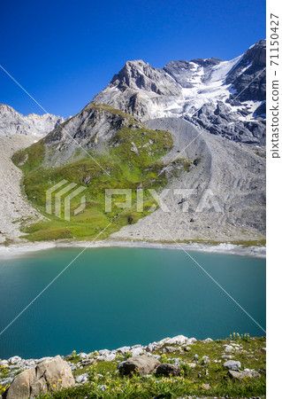 Long lake and Grande Casse Alpine glacier in French alps 71150427