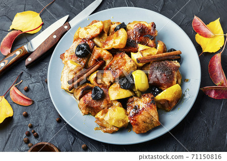 Stewed meat with apples. 71150816