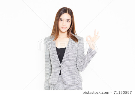 Business woman making an OK gesture 71150897