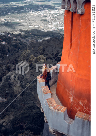 Young woman contemplating the landscape from Palacio da Pena in Sintra, Portugal 71151822