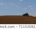 Tractor working under the blue sky 71152082