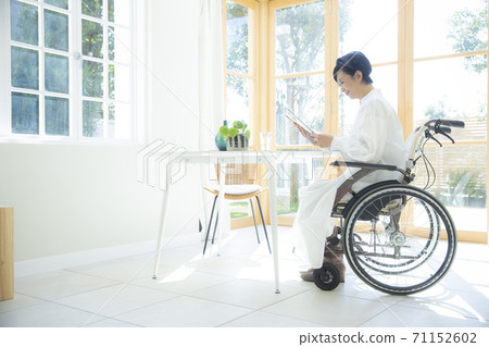 Cafe woman wheelchair Cafe woman wheelchair 71152602
