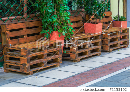 Empty outdoors tables as Coronavirus measures affect business & life in Greece. 71153102