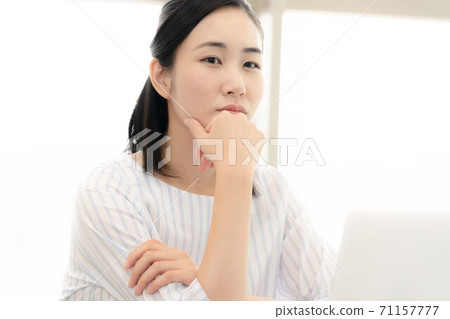 A young woman headed to a computer 71157777