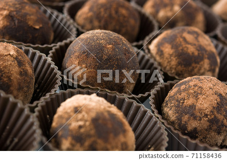 Delicious chocolate truffles with cocoa dusted Delicious chocolate truffles with cocoa dusted 71158436