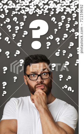 Bearded guy with glasses feeling puzzled, collage with question marks 71159692