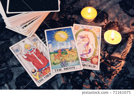 Tarot cards by candlelight on dark background fortune card prophecy gypsy card for fortune teller reading future Tarot cards by candlelight on dark background fortune card prophecy gypsy card for fortune teller reading future 71161075