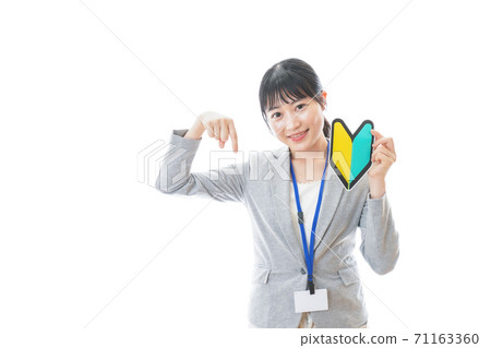 Young business person with a beginner mark Young business person with a beginner mark 71163360