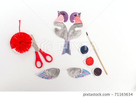 Paper cut bullfinch bird craft for children. Winter holiday Home decoration. Paper cut bullfinch bird craft for children. Winter holiday Home decoration. 71163634