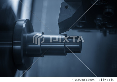 The  CNC lathe machine cutting the metal shaft parts.  71164410