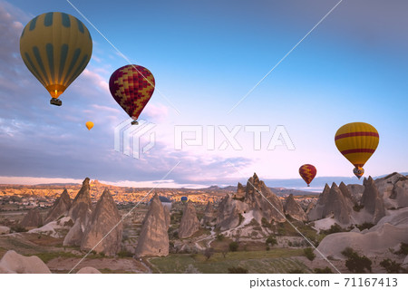 Hot air balloon flying over Cappadocia, Turkey 71167413