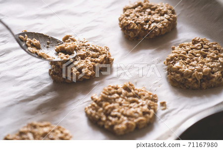 paleo dessert, homemade cookies made of oatmeal and banana. 71167980