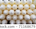 Stacks of candles with selective focus in a shelf shown in a small store. 71168679