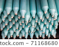 Stacks of candles with selective focus in a shelf shown in a small store. 71168680