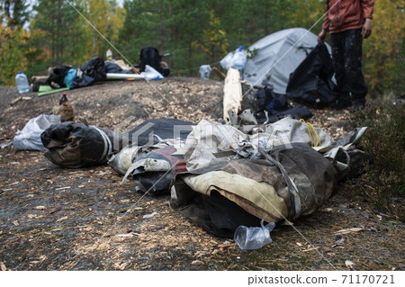 big amount of trash in forest, family father and son picking garbage away, global environment issues big amount of trash in forest, family father and son picking garbage away, global environment issues 71170721