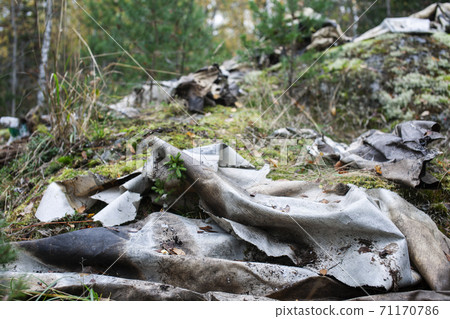 big amount of trash in forest, global environment issues 71170786