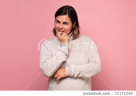 Portrait of a smiling thinking woman making a plan. 71171293