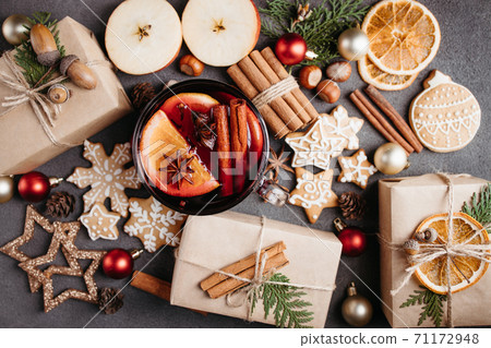 Holiday background with mulled wine and gift boxes Holiday background with mulled wine and gift boxes 71172948