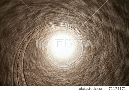 Tube tunnel with bright light in the end 71173171