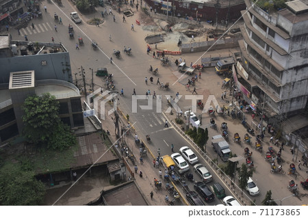 Bangladesh Dhaka's developing cityscape Cycle rickshaw running on the road and automobiles at high-traffic intersections Bangladesh Dhaka's developing cityscape Cycle rickshaw running on the road and automobiles at high-traffic intersections 71173865