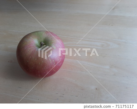 One apple on the table One apple on the table 71175117
