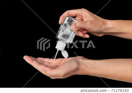 Portable small hand sanitizer bottle. Woman using to go dispenser for clean hands while commuting or shopping 71176183