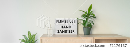 Coronavirus business sign asking customers to disinfect hands with hand sanitizer upon entrance of store. Corona virus prevention banner 71176187