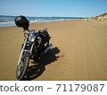 Sandy beach on a motorcycle 71179087